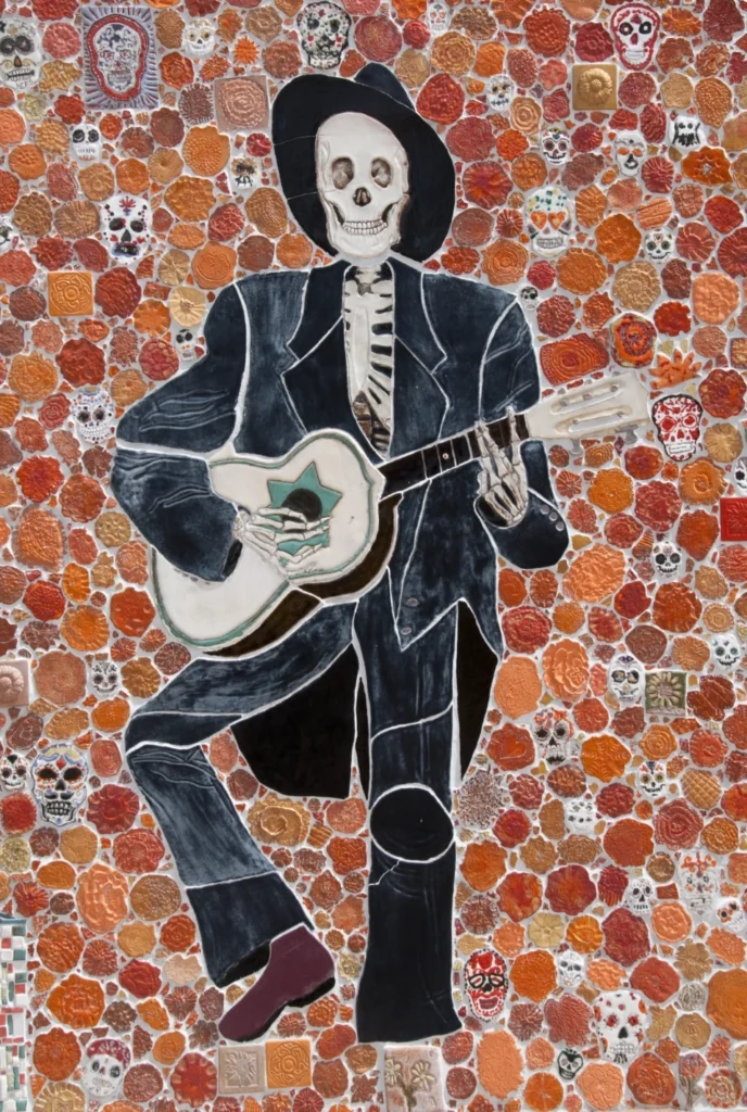 Detail from Silver City Museum mural of a guitar player